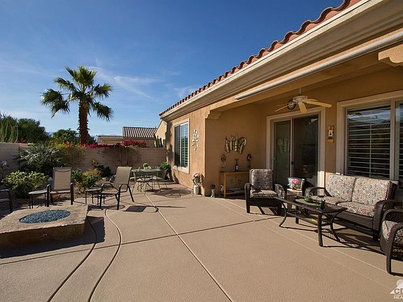 Great corner lot with tons of sunshine. Backyard with firepit and water feature and extended patio