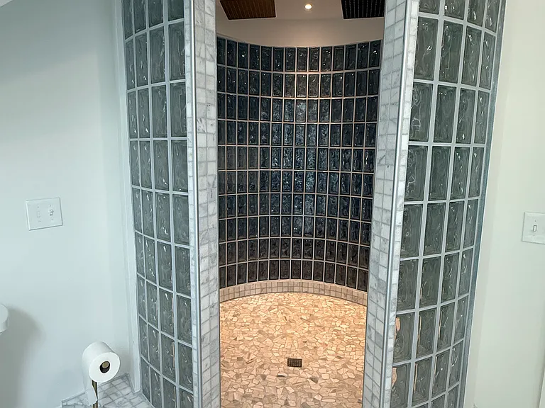 3rd floor primary spa bathroom with soaker tub and huge circular shower with double showerheads