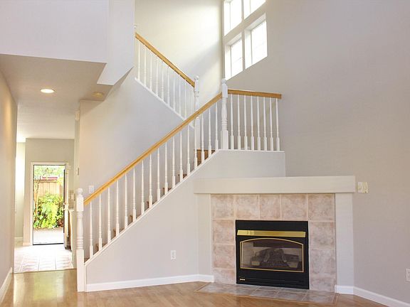 From the front door into the living room you get a glimpse of the spaciousness of the home and how it opens to your private backyard.