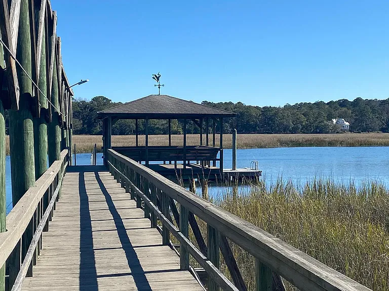 Boast hoist and boat dock at high tide