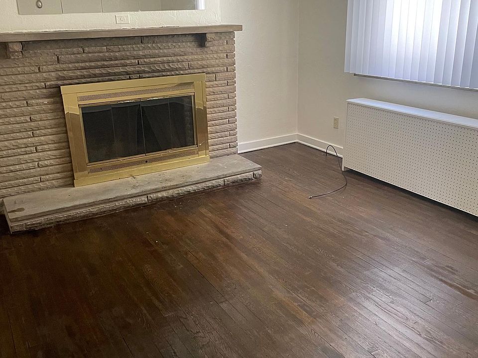 Living room features a fireplace.