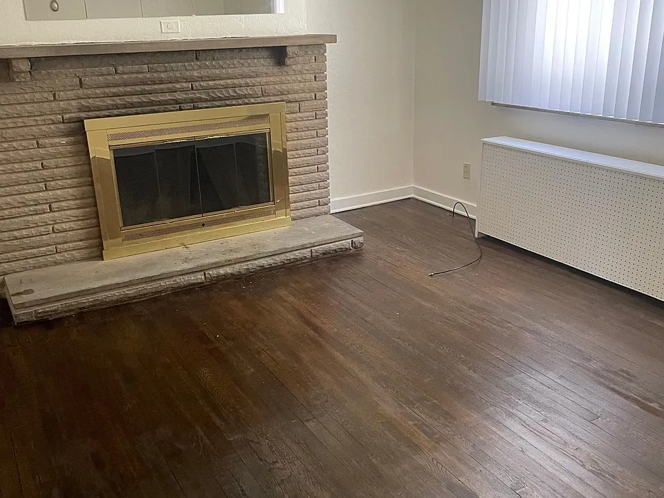 Living room features a fireplace.