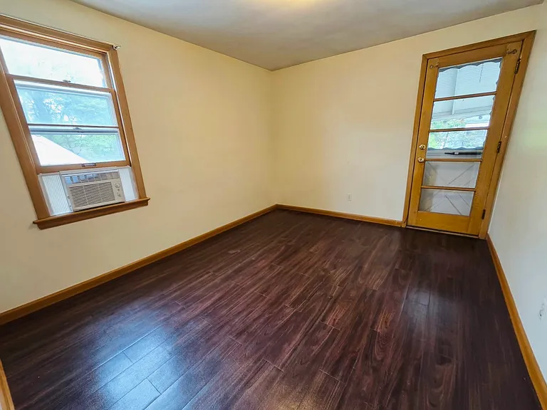 Bedroom 2 with entrance to balcony porch