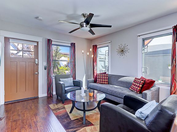 Reverse of living room and front door.