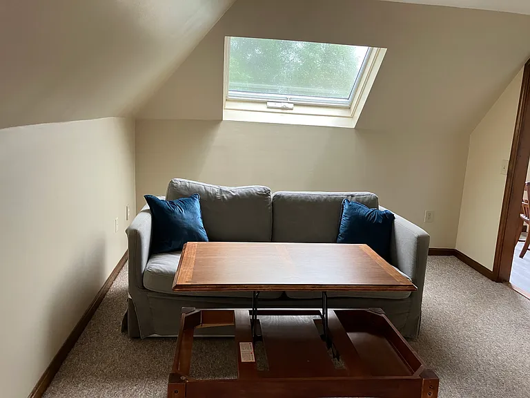 Living area with sofa & raisable coffee table