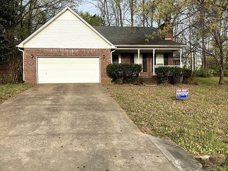Front Exterior with long driveway, and two car garage.