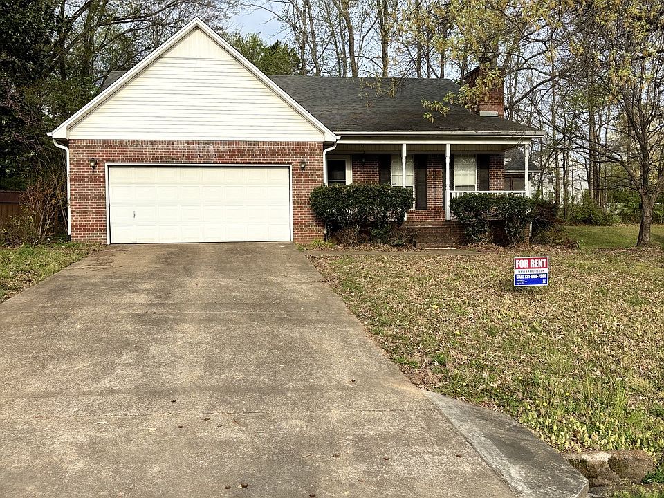 Front Exterior with long driveway, and two car garage.