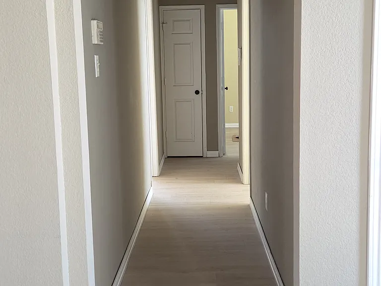 hallway to 3 bedrooms and hall bathroom