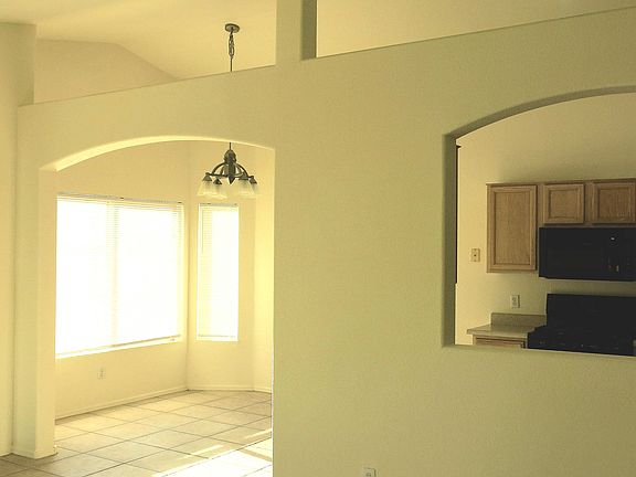 Arched doorway from living room to dining room