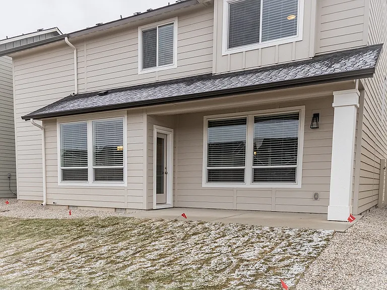 Backyard has covered porch and all yard care is taken care of by property management. Enjoy!