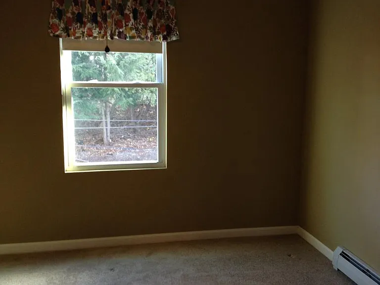 Second bedroom with ceiling fan and large closet