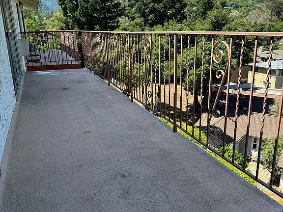 Look out at the beautiful Santa Cruz Mts while sipping coffee or vino from the long balcony