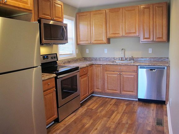 Large kitchen offers plenty of natural lighting and stainless steel appliances.
