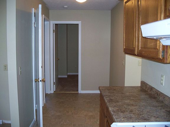 view from kitchen down hall to den or 5th bedroom