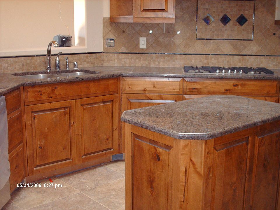 kitchen with custom alder cabinets and granite