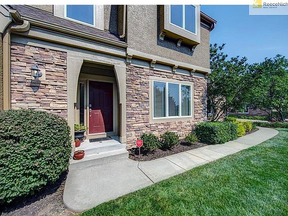 Private front door entrance with a side entry garage.