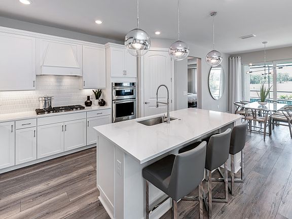 Gourmet kitchen with center island and stainless steel appliances