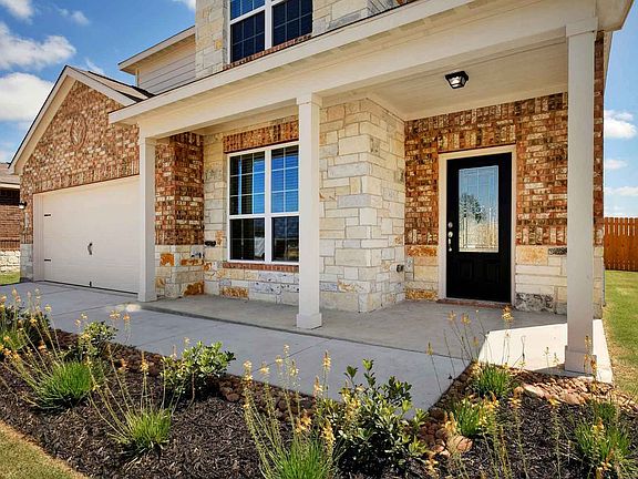 Charming covered front porch entry waiting for you to add your rocking chairs
