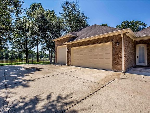 The single bay on the left is 31' deep and 10' in height... large toys have a proper home. The single bay is also prepped for a future MIL conversion with an exterior door and window, as well as a door header within the wall that lies between the gar