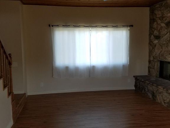 Living room with large window for lots of natural light.