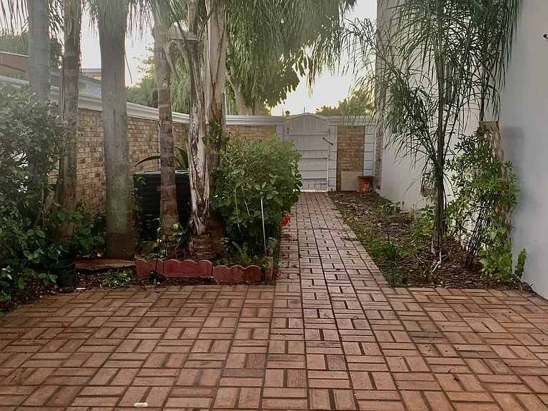 private patio and locked gate to parking.