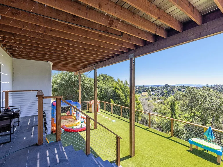 Landing and deck on lower level, accessed from lower level living / play space