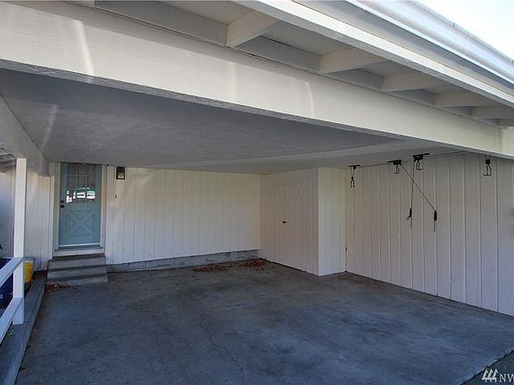 Car port in back with lots of extra parking. 