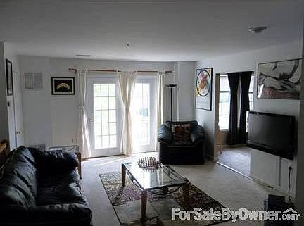 Living Room
						:
						Sun filled Living Room with French doors leading to deck. New carpeting