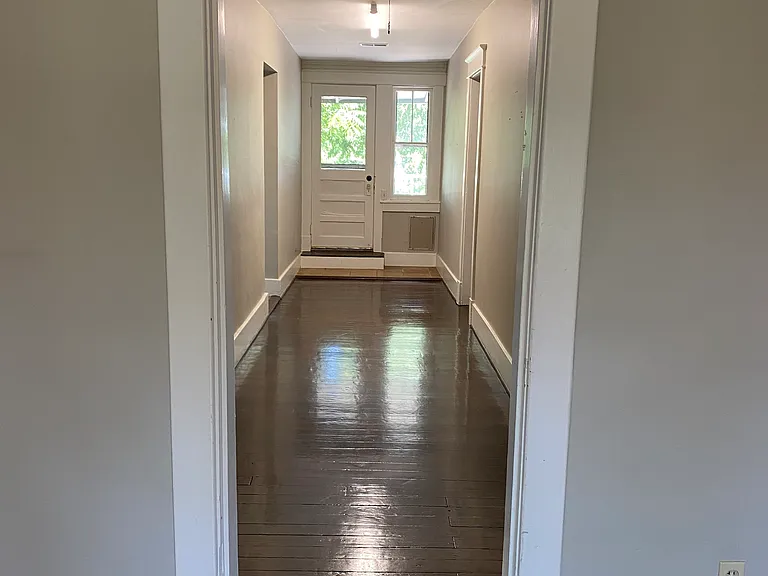 hallway from living room looking at back entrance