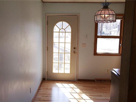 Entering kitchen from the living room; door to the deep back yard