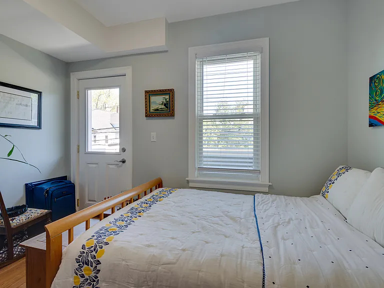 Second bedroom leads to front balcony
