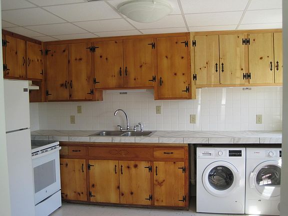 Kitchen cabinetry with appliances.