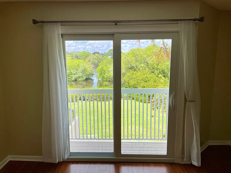 View of river from main bedroom, floor to ceiling slider