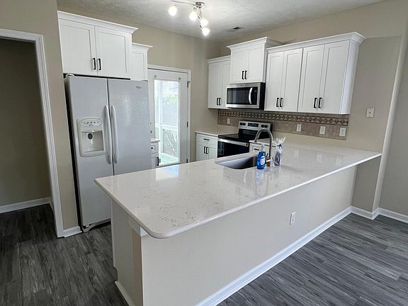 Brands new Quartz countertops, stainless steel appliances, and cabinets.