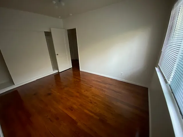 second bedroom with wall to wall closet