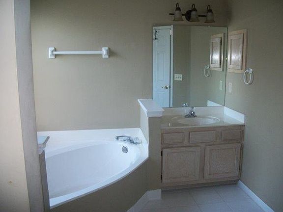 his/hers sinks and closets, garden tub and shower