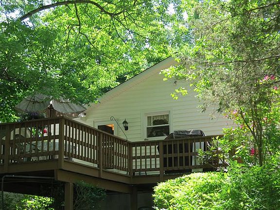 Oversized back deck with entrance to the kitchen.