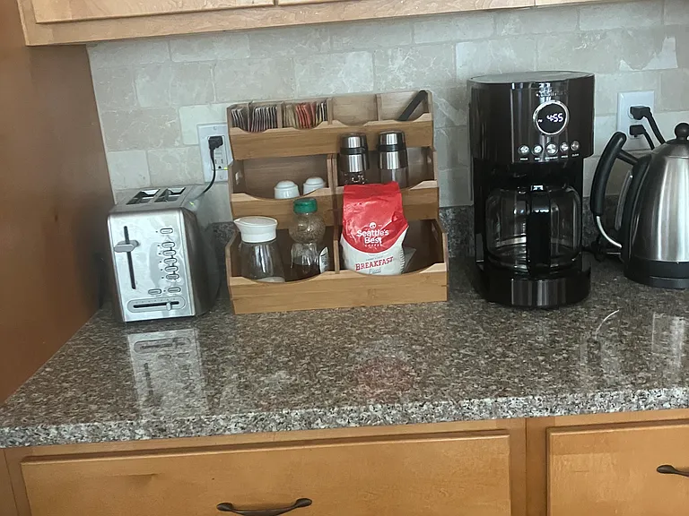 The coffee station is stocked with a coffee maker, tea, sugar, honey, and hot water for your perfect morning brew. Step outside to the front porch swing and enjoy serene mountain relaxation while overlooking the breathtaking Ogden Valley.