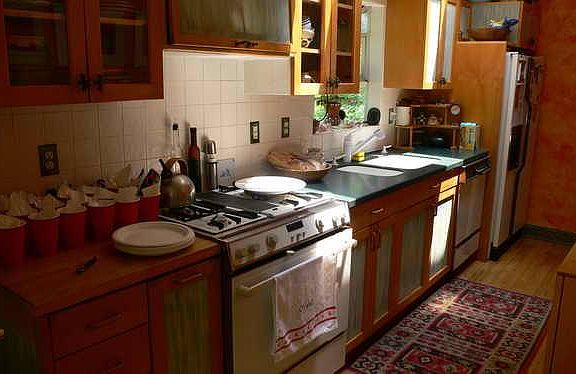 Kitchen, Jenn-Air dual fuel stove, Corian counter, Bosch dishwater, butcher block, custom built wood cabinet.