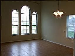 Another view of the formal living and dining area with tile flooring