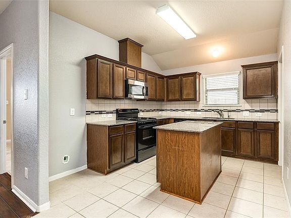 OPEN KITCHEN OFF OF LIVING AREA