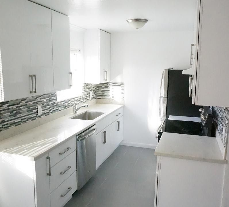 Remodeled kitchen with dishwasher and new stainless steel ap