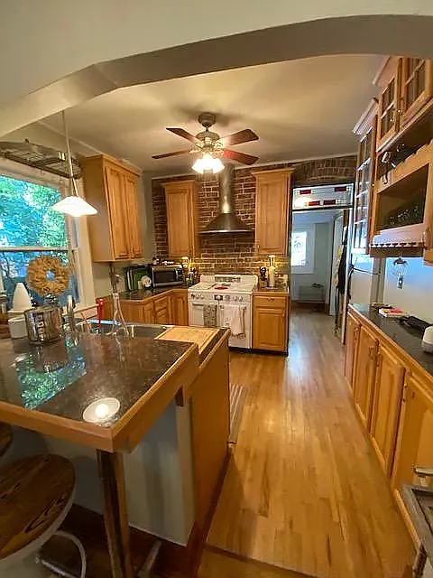 Stove in this picture has been replaced with modern stainless stove. - 1847 S Emerson St