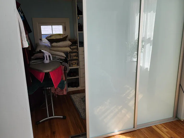 Sliding door to master bedroom's walk-in closet.