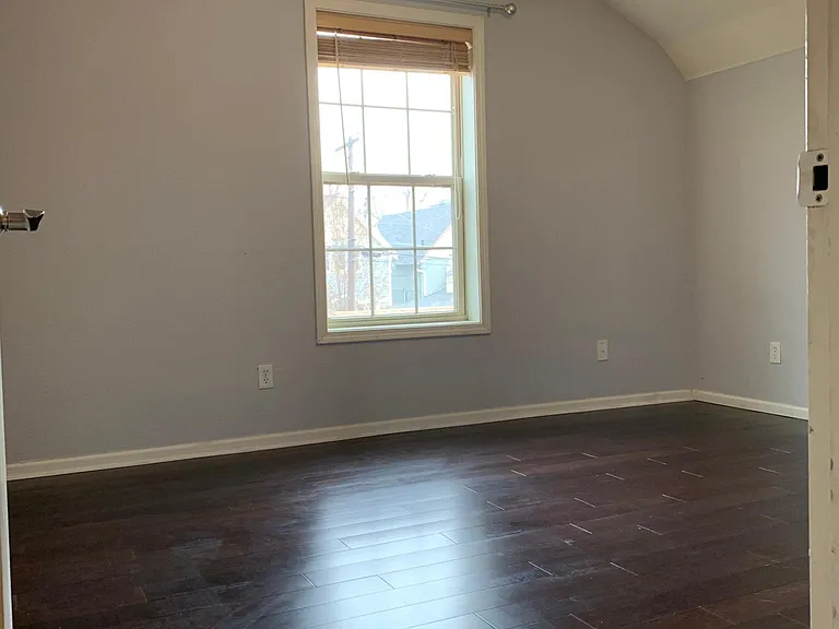Large 2nd bedroom w/bamboo floors and walk-in closet. Vacant pic.