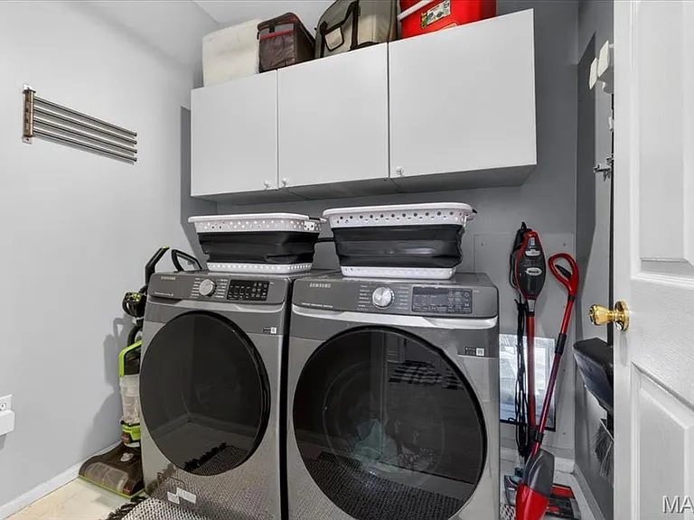 Built-in white cabinetry provides storage