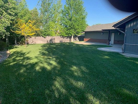 Full size fenced in backyard