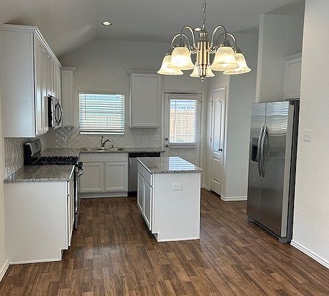 The Blue Jay- Kitchen island not included . Similar elevation floor plan. Home under construction.