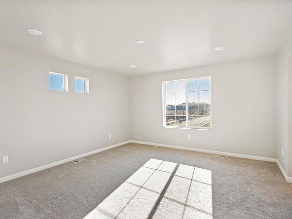 A view of the primary bedroom and windows