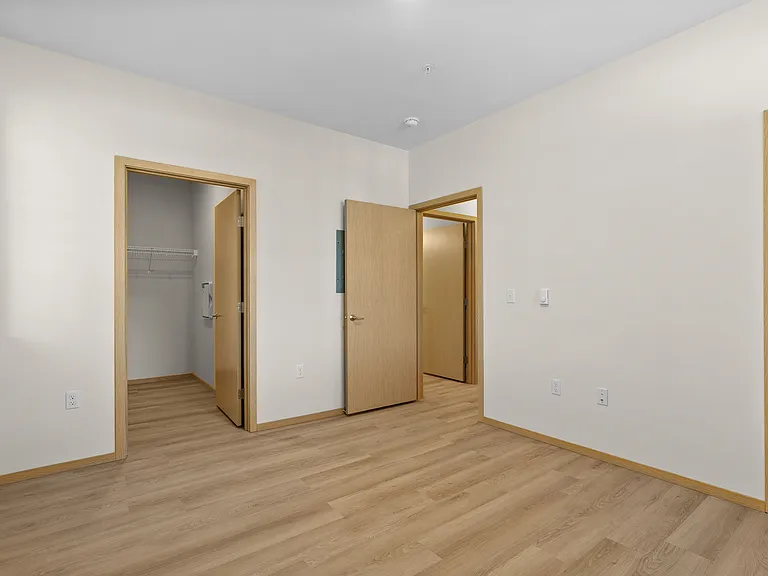 Spacious bedroom with dual closets for added storage. Spacious bedroom with dual closets for added storage.